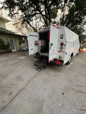 Magnet Plumbing service vehicle on-site for Grease Trap Cleaning in Dillard